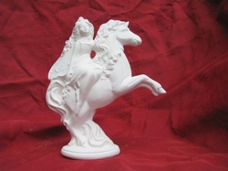 Ceramic unpainted fairy on a unicorn